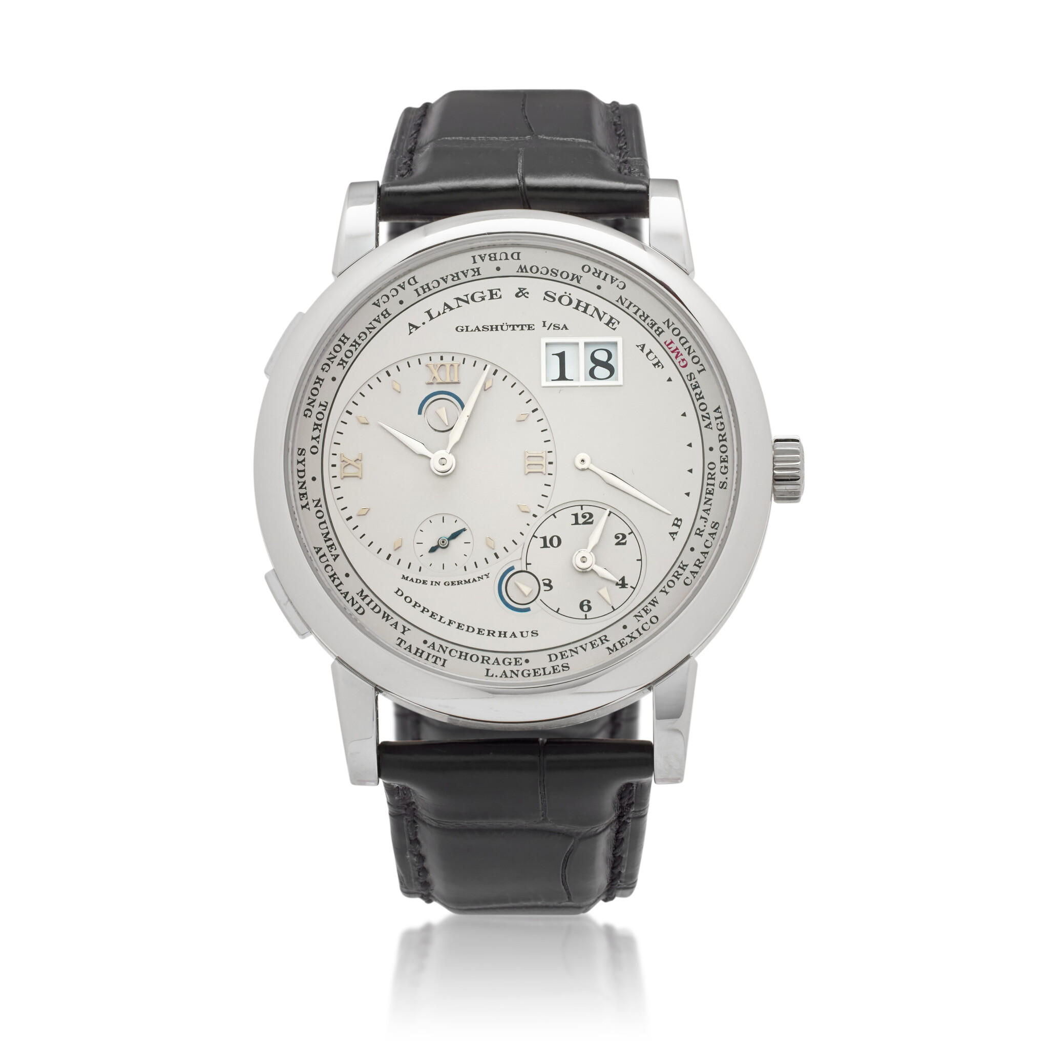 Lange 1 Time Zone (Reference 116.025). A 41.9mm platinum manual wind wristwatch with date,  day/night indicator, power reserve, and time-zone function. — view 1