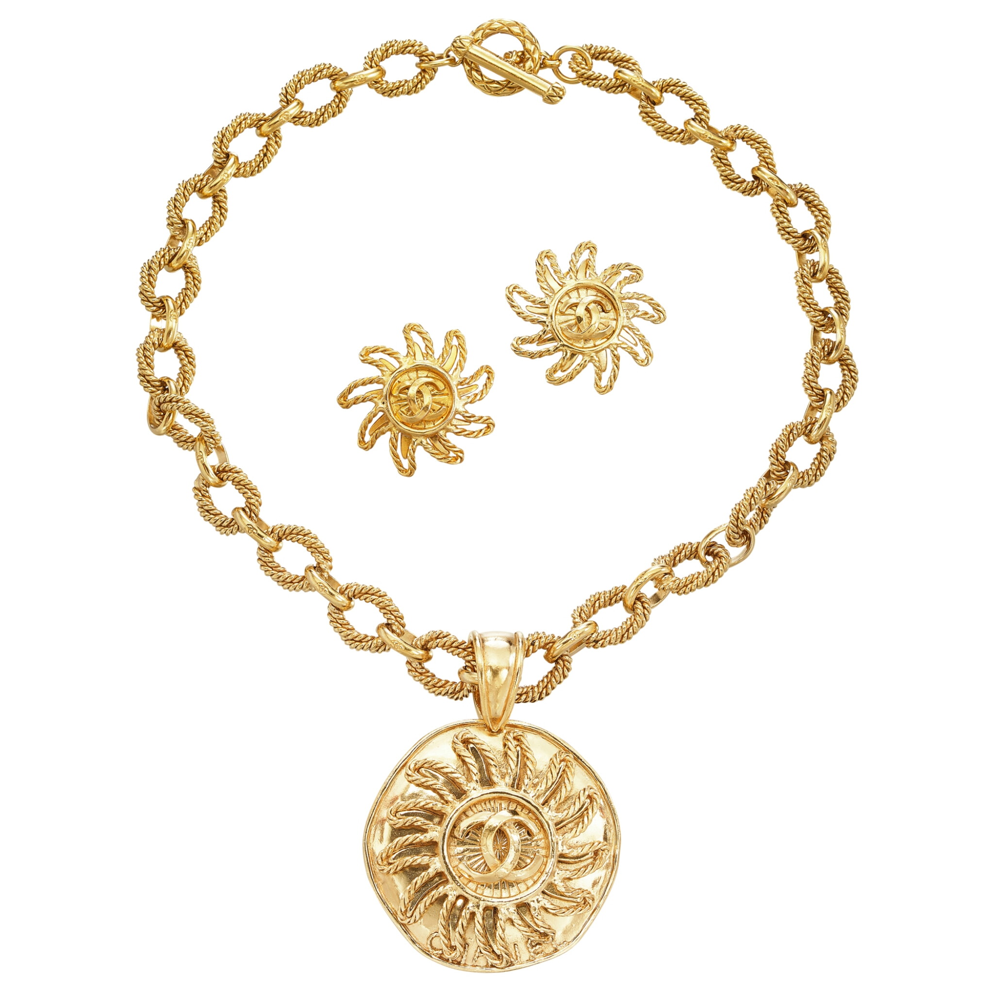 Gold Metal Medallion Sun Pendant Necklace and Clip-On Earrings — view 1