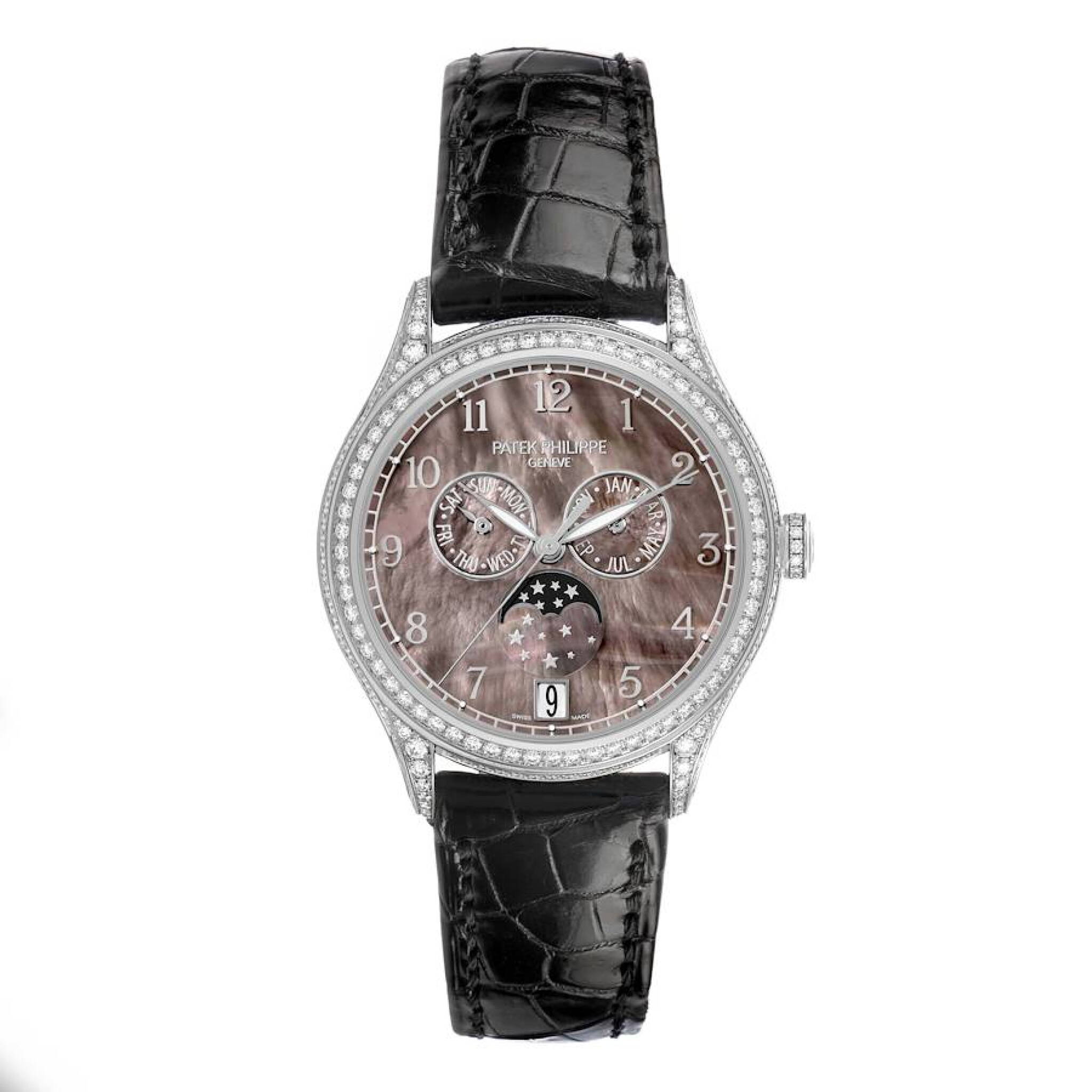 Complications (Reference 4948G). A 38mm white gold diamond-set automatic wristwatch with date, day, month, moon phase, and annual calendar. — view 1