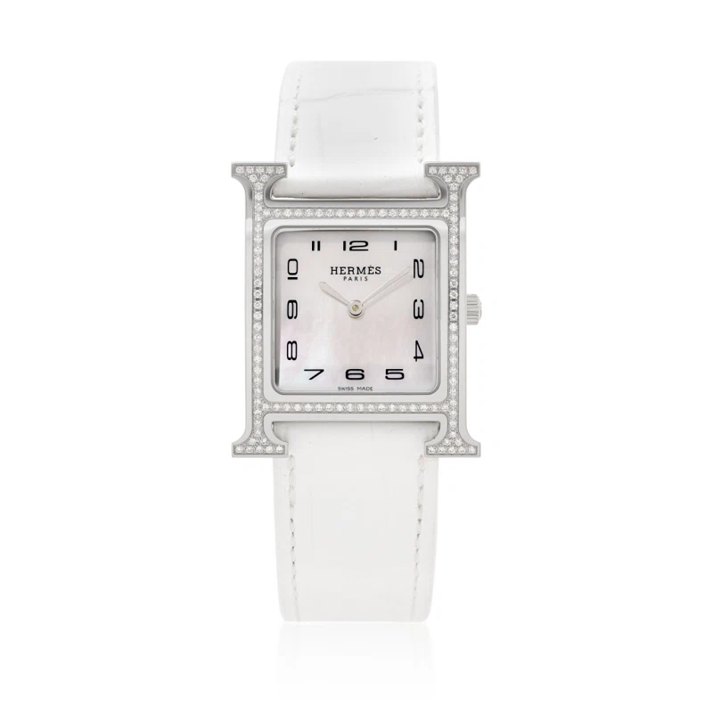 Heure H Small (المرجع HH1.531). ساعة يد من الفولاذ المقاوم للصدأ بقطر 25mm، مرصّعة بالألماس، بحركة كوارتز. 2022