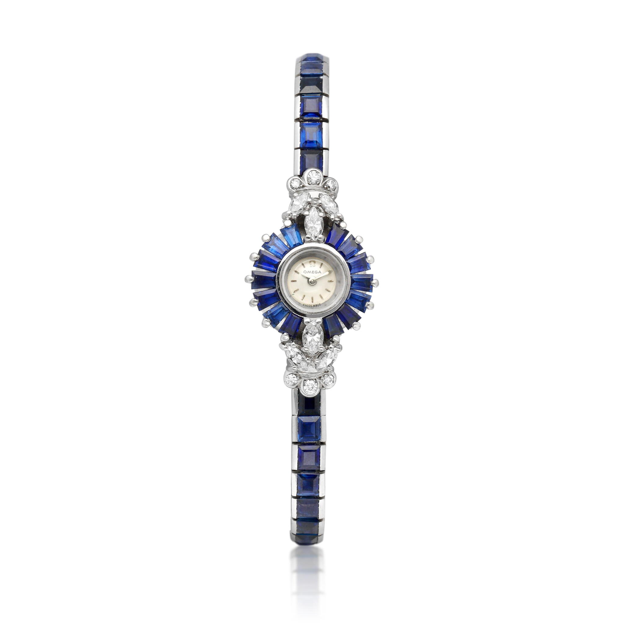 Omega. A white gold, diamond and sapphire-set manual wind bracelet watch. Circa 1960 — view 1