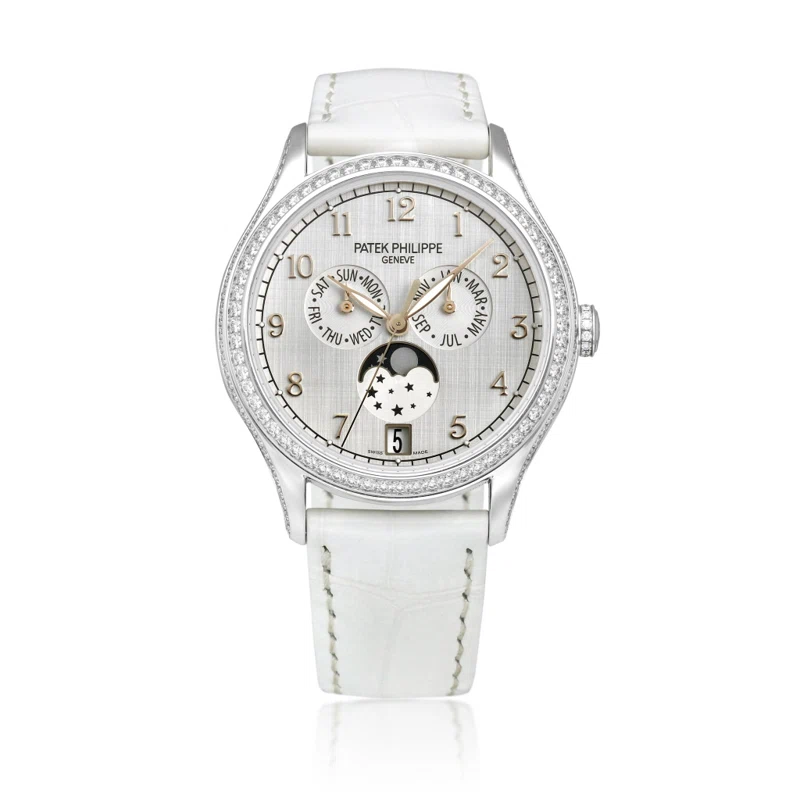 Complications (Reference 4947). A 38mm white gold diamond-set automatic wristwatch with date, day, month, moon phase, and annual calendar. 2019