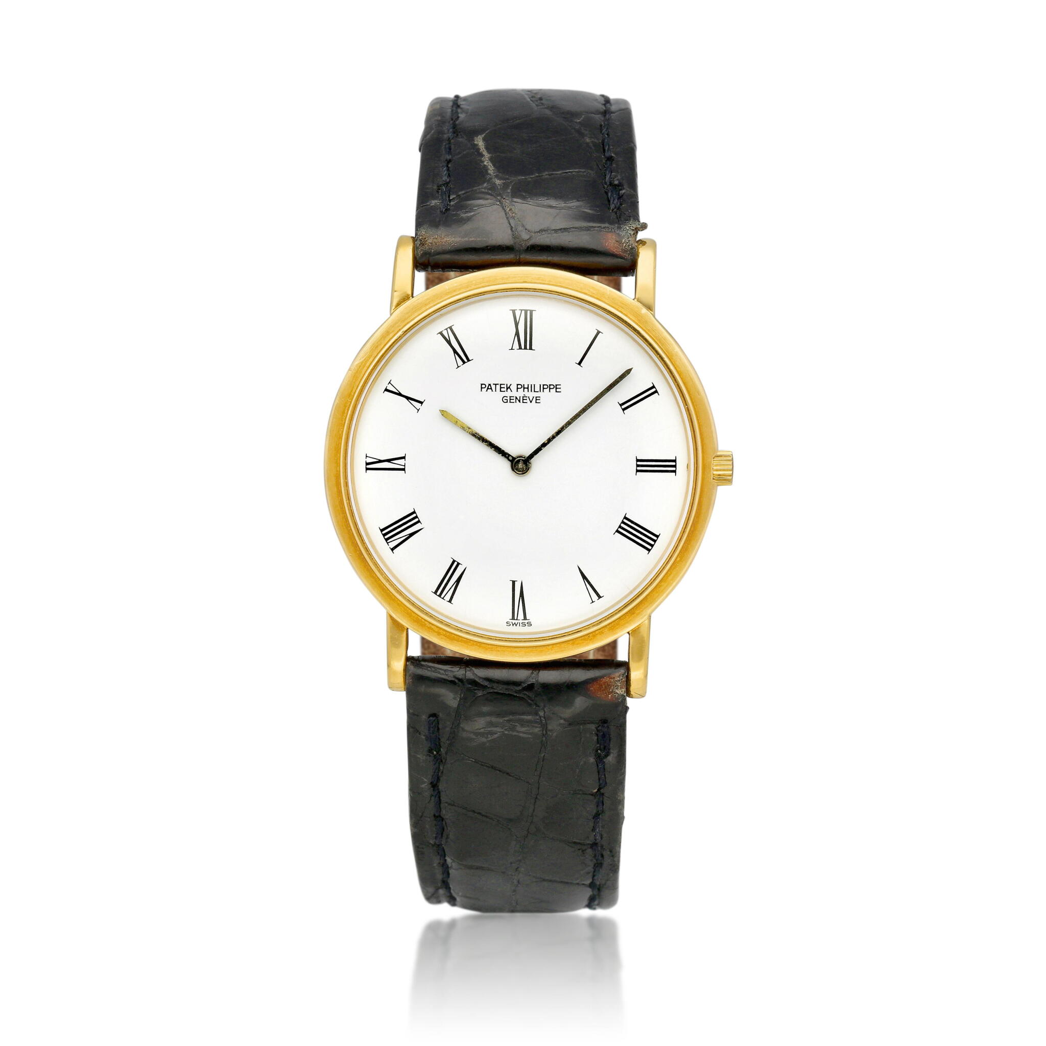 Calatrava (Reference 3520). A 32mm yellow gold manual wind wristwatch. 1990 — view 1