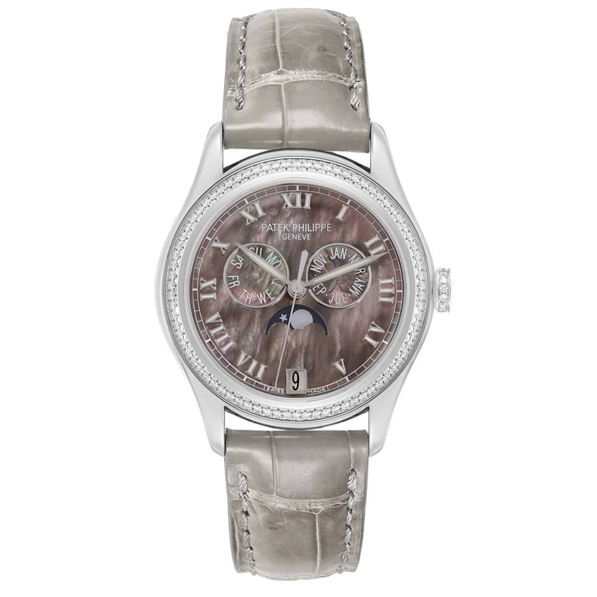 Complication (Reference 4936G). A 37mm white gold diamond set automatic wristwatch with date, day, month, moon phase, and annual calendar. — view 1