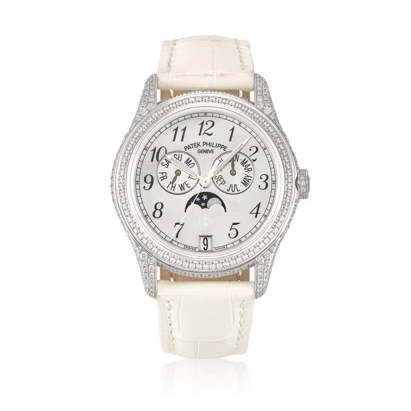 Complications. (Reference 4937G-001). A 37mm white gold diamond-set automatic wristwatch with date, day, month, moon phase, and annual calendar. 2012