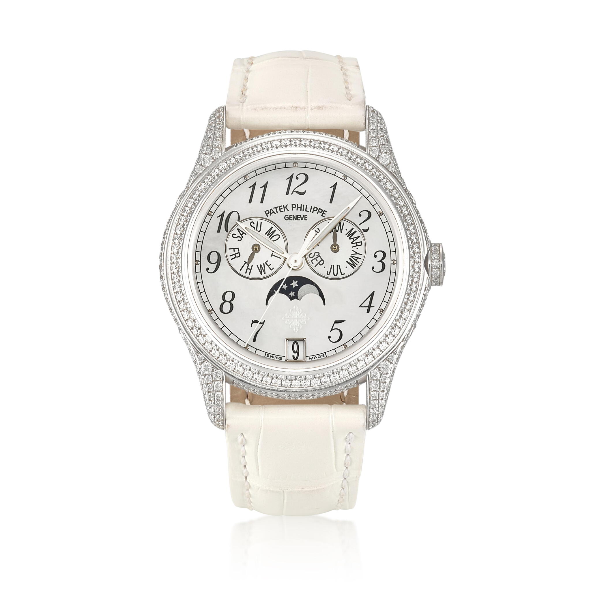 Complications. (Reference 4937G-001). A 37mm white gold diamond-set automatic wristwatch with date, day, month, moon phase, and annual calendar. 2012 — view 1