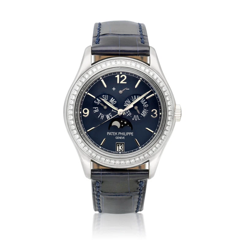 Complications (Reference 5147G). A 39mm white gold diamond-set automatic wristwatch with moon phase, power reserve indication and annual calendar. Circa 2007