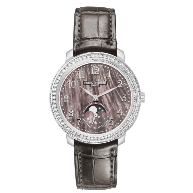Complications (Reference 4968G). A 33.3mm white gold diamond-set manual wind wristwatch with moonphase.