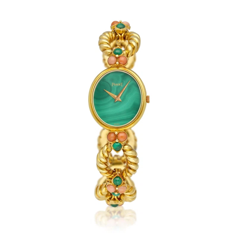 Piaget (Reference 94151 R21). A yellow gold, malachite and coral-set mechanical bracelet watch with malachite dial. Circa 1975