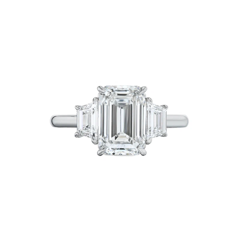 Platinum and 4.02ct Emerald Cut Diamond and Diamond Three Stone Engagement Ring