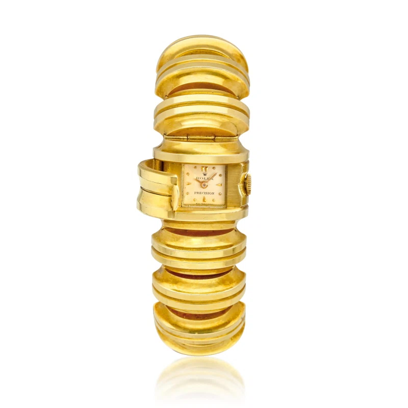 Precision (Reference 4615). A 21.5mm yellow gold manual wind bracelet watch with concealed dial. 1947