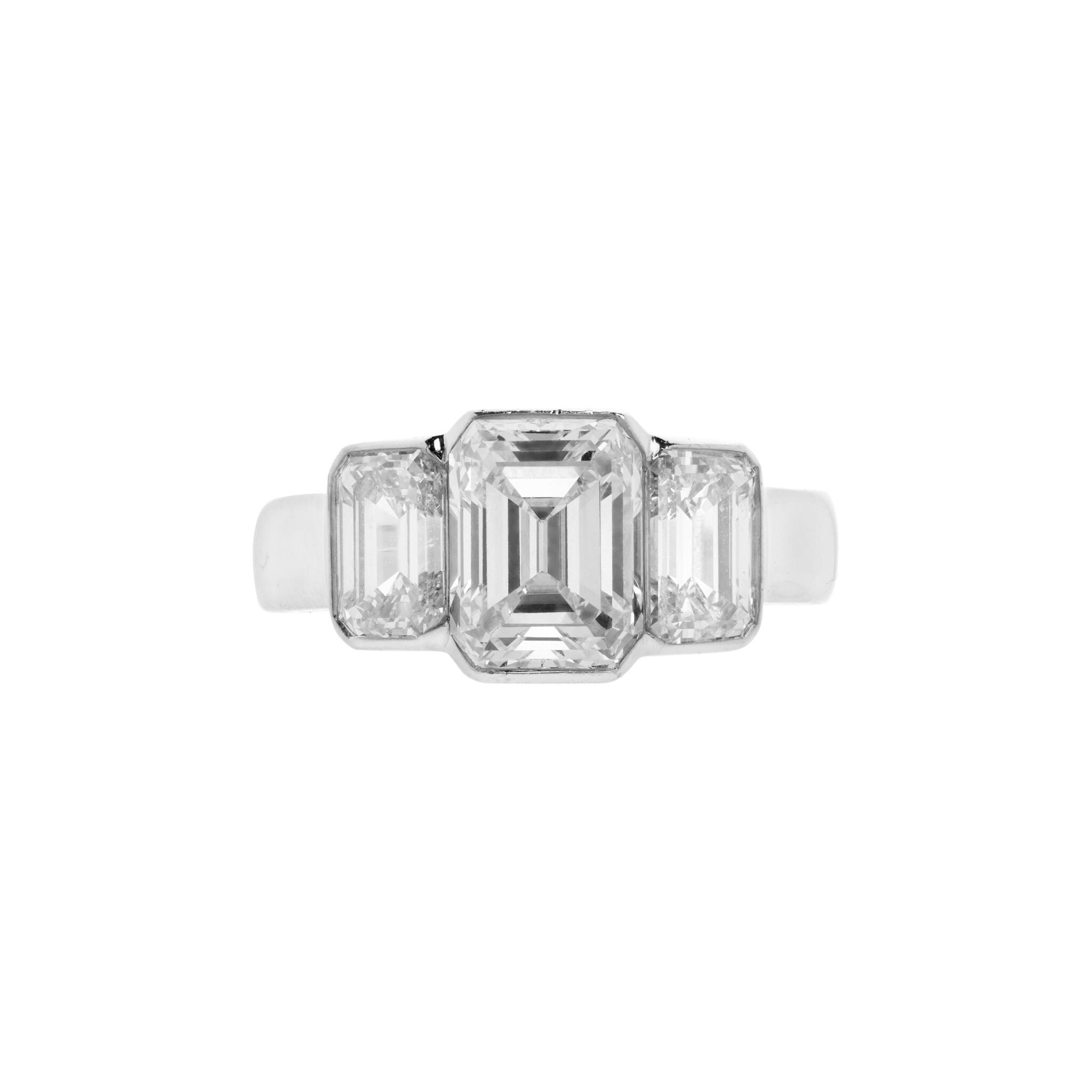 Platinum, 2.24ct Emerald Cut Diamond and Diamond Three Stone Engagement Ring — view 1
